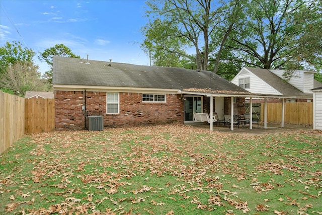 back of house featuring central AC unit and a patio