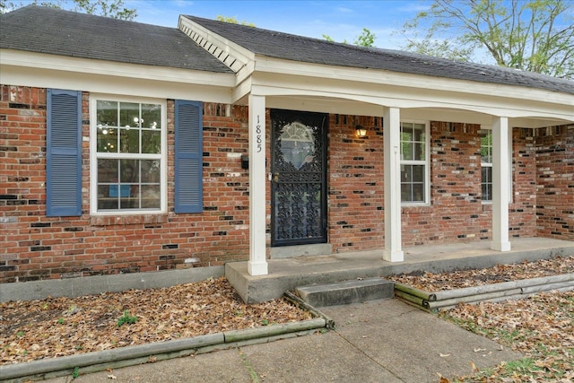 doorway to property with covered porch