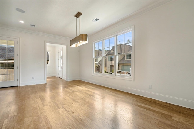 unfurnished dining area with wood-type flooring and ornamental molding