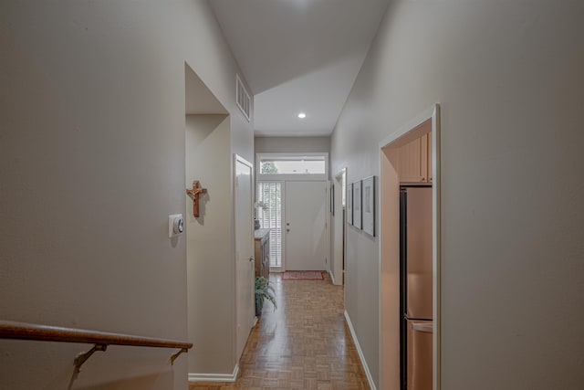 corridor with light parquet flooring