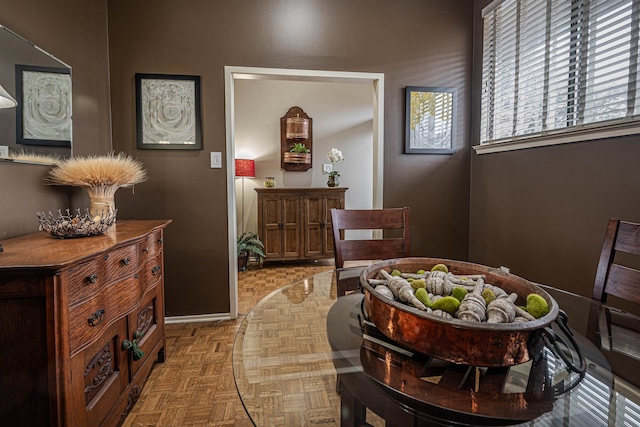 dining space featuring light parquet floors