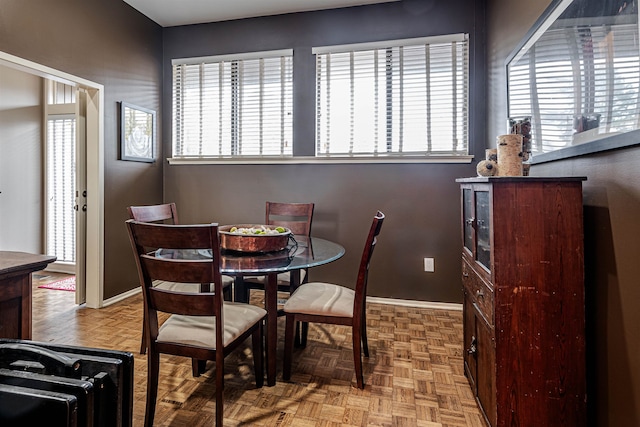 dining area with parquet floors