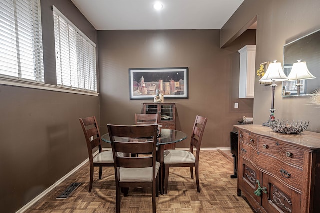 dining room with dark parquet floors