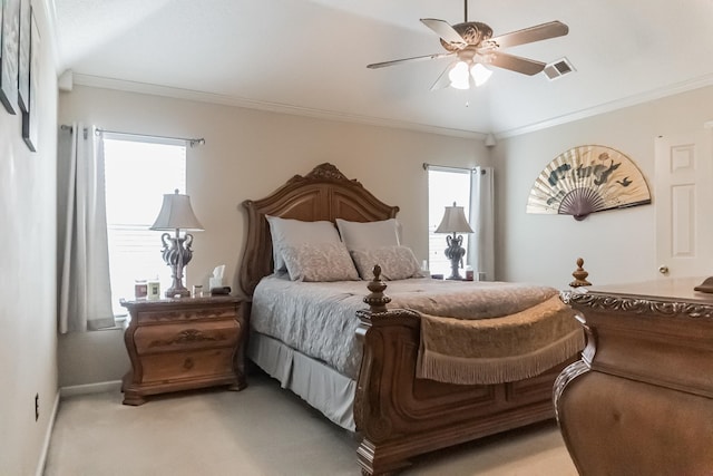 bedroom featuring ornamental molding, light colored carpet, multiple windows, and ceiling fan