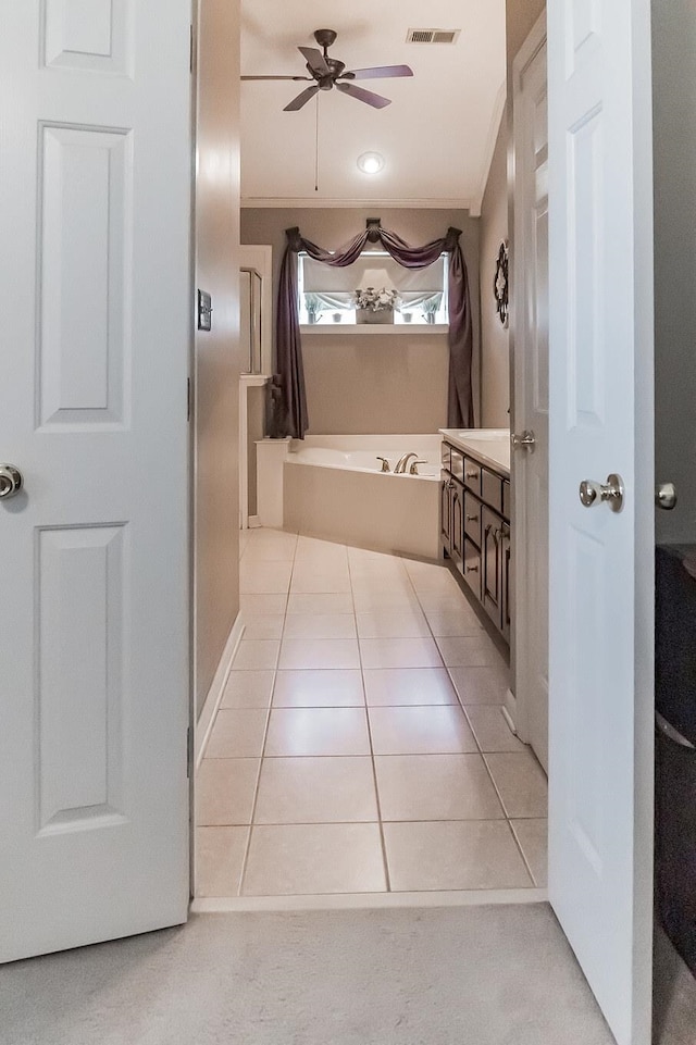 bathroom featuring ornamental molding, tile patterned flooring, and ceiling fan