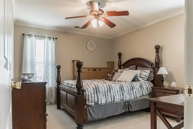 bedroom with ornamental molding, light colored carpet, and ceiling fan