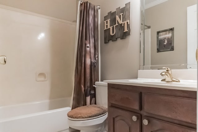 full bathroom featuring toilet, vanity, shower / bath combo with shower curtain, and ornamental molding