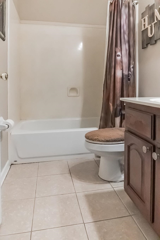 full bathroom featuring vanity, tile patterned flooring, toilet, and shower / bathtub combination with curtain