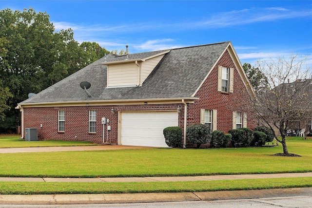 view of property exterior with a lawn, a garage, and central AC unit