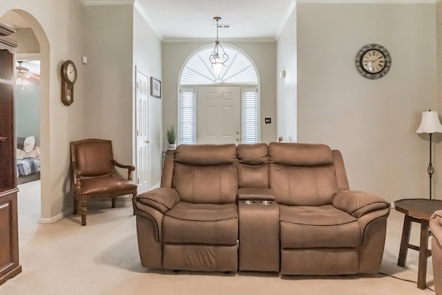 living room featuring ornamental molding, a notable chandelier, and light carpet