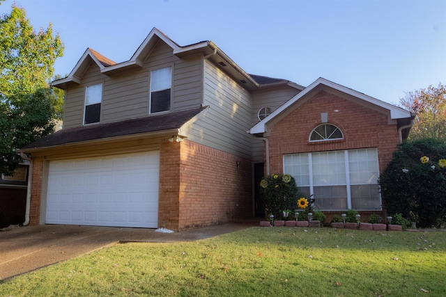 view of front property with a garage and a front yard