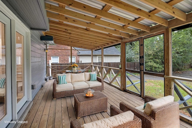 sunroom / solarium with vaulted ceiling