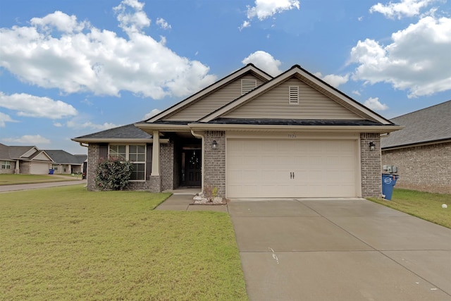 view of front of home featuring a garage and a front yard