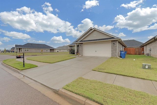 view of front of home with a garage and a front lawn