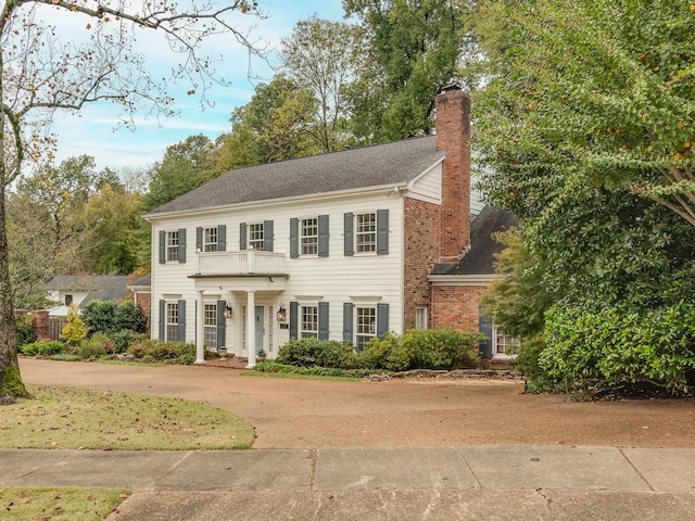 colonial home with a balcony