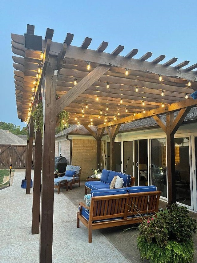 patio terrace at dusk with grilling area, outdoor lounge area, and a pergola