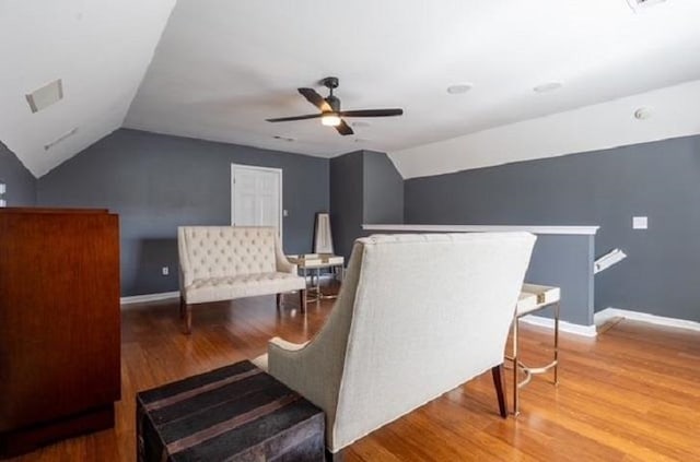 sitting room featuring lofted ceiling, wood-type flooring, and ceiling fan