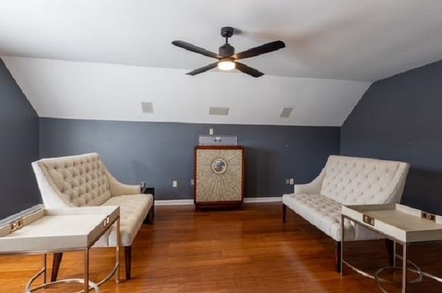 sitting room with dark hardwood / wood-style floors, ceiling fan, and vaulted ceiling