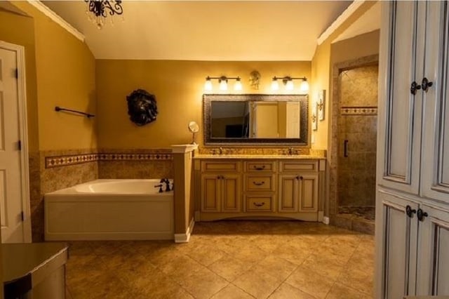 bathroom with vanity, plus walk in shower, lofted ceiling, crown molding, and tile patterned floors