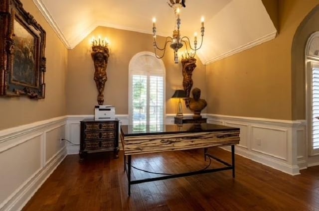 interior space featuring ornamental molding, dark hardwood / wood-style floors, a chandelier, and vaulted ceiling