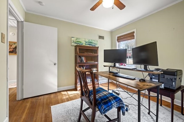 home office with ceiling fan, wood-type flooring, and crown molding