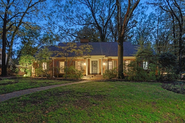 ranch-style home with a front yard