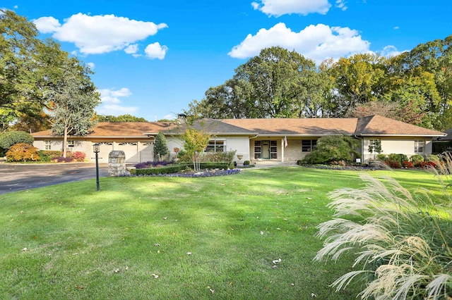 280 Waring Rd, Memphis, TN 38117 - ranch-style home with driveway, an attached garage, and a front lawn