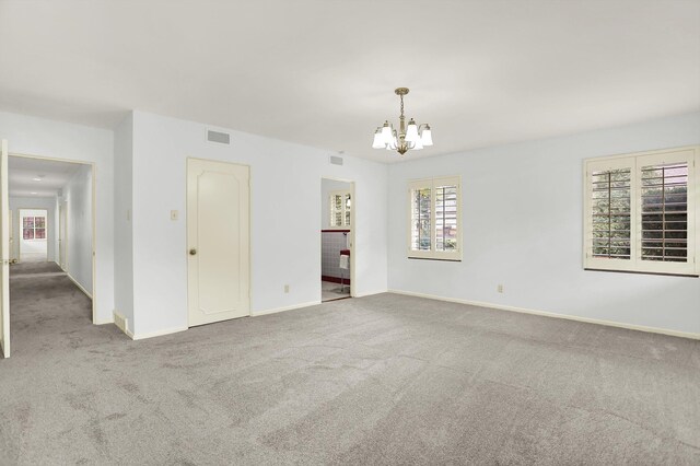 280 Waring Rd, Memphis, TN 38117 - spare room featuring a chandelier and carpet floors