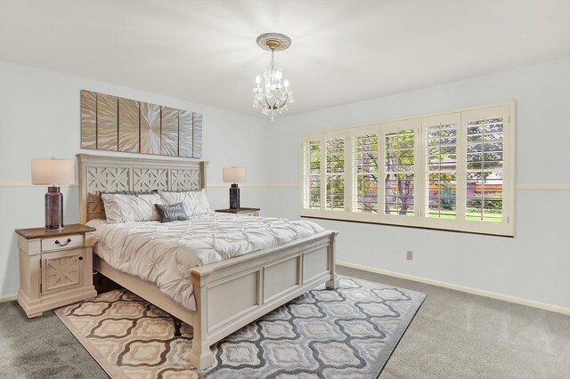 280 Waring Rd, Memphis, TN 38117 - carpeted bedroom featuring a chandelier and baseboards