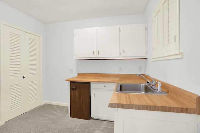 280 Waring Rd, Memphis, TN 38117 - kitchen with white cabinets, light carpet, and wooden counters