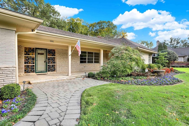 280 Waring Rd, Memphis, TN 38117 - entrance to property with a lawn and brick siding