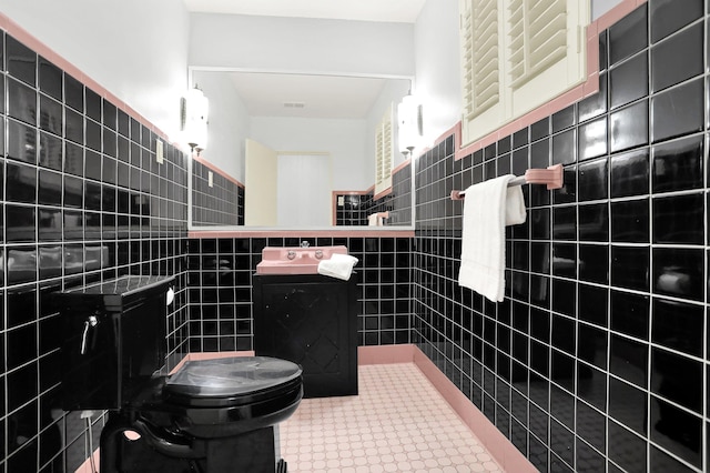 280 Waring Rd, Memphis, TN 38117 - bathroom with tile walls, vanity, tile patterned flooring, and wainscoting