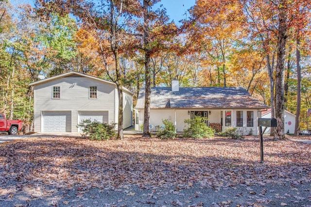 view of front of property with a garage and a porch