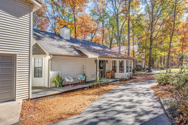 view of front of home featuring a garage and covered porch