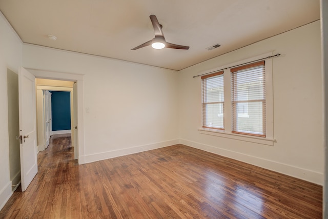 spare room with ceiling fan and wood-type flooring