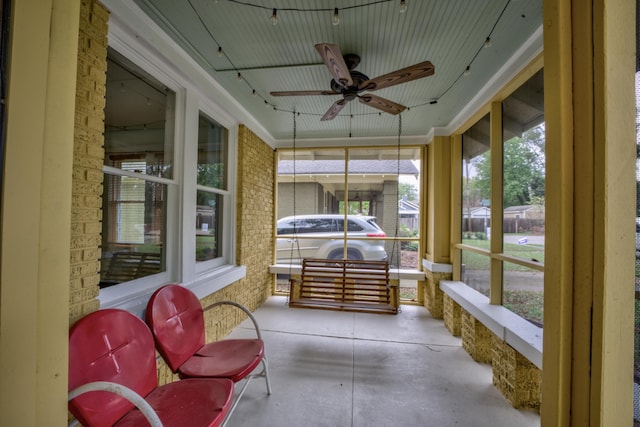 sunroom / solarium with ceiling fan