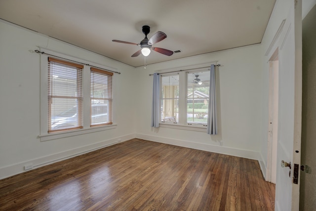 spare room with dark hardwood / wood-style floors and ceiling fan