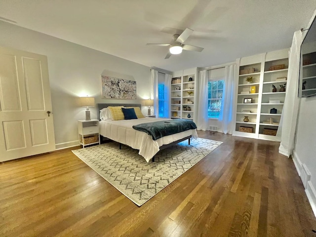 bedroom featuring hardwood / wood-style floors and ceiling fan