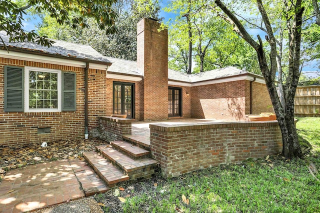 back of property featuring a patio area