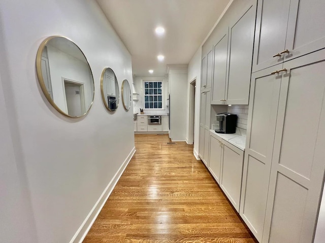 hallway featuring light hardwood / wood-style flooring