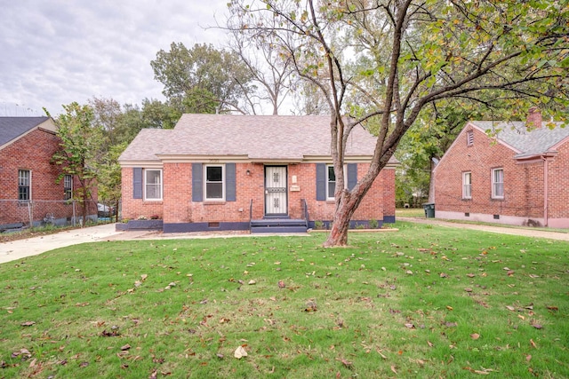 ranch-style house with a front lawn