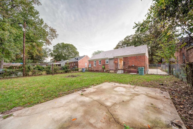 exterior space featuring a lawn and a patio