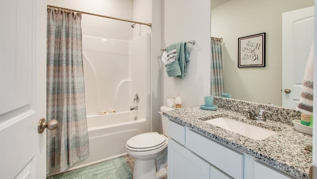 full bathroom with shower / tub combo with curtain, vanity, and toilet