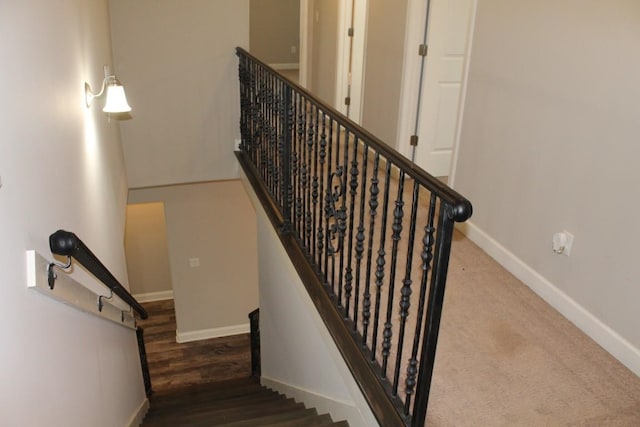 stairs with wood-type flooring