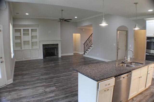 kitchen featuring white cabinetry, dark hardwood / wood-style flooring, sink, an island with sink, and stainless steel dishwasher