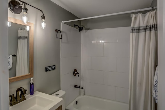 full bathroom featuring vanity, shower / bath combo with shower curtain, and toilet