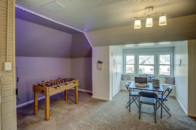 recreation room with carpet flooring and vaulted ceiling