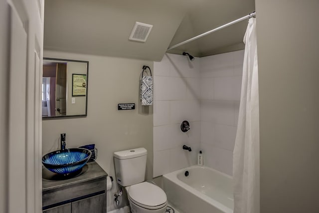 full bathroom featuring toilet, shower / bath combo, and vanity