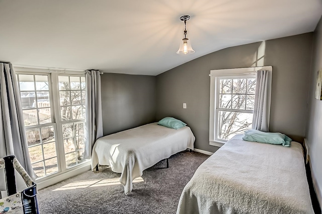 bedroom with carpet flooring and lofted ceiling