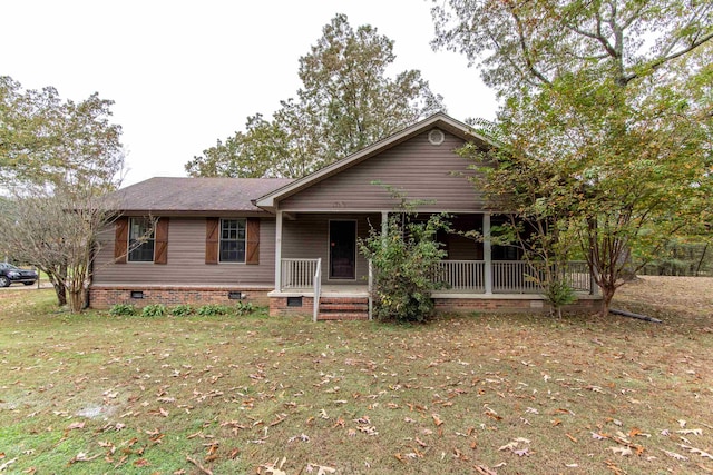 single story home with covered porch and a front lawn